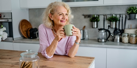 Old woman drinking coffee