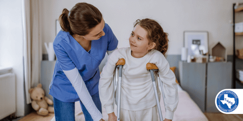 Young nurse helping to walk to little girl with a broken leg.
