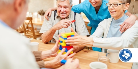 caregiver playing games with elderly