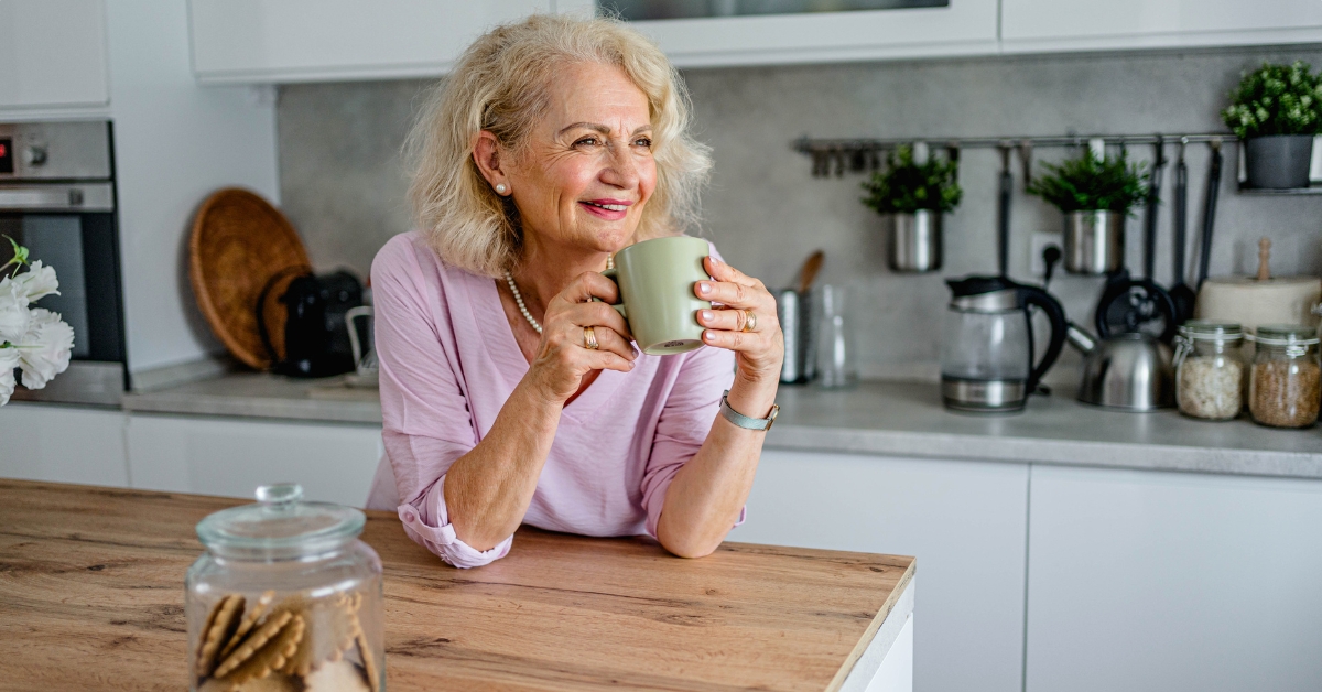 Old woman drinking coffee