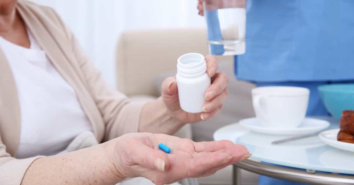 Senior citizen taking medication